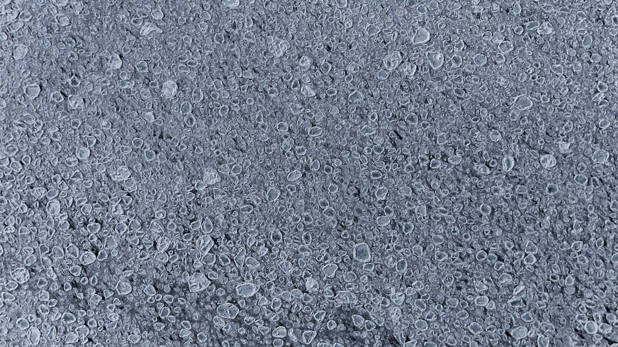 Detailed view of frozen bubbles on an icy surface capturing winter textures. — UV-resistant epoxy top coat